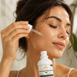 Applying snail mucin serum to face and neck