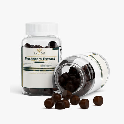Two clear supplement bottles labeled ELIXAR Mushroom Extract on a light gray background, with one bottle standing upright and the other lying on its side, and several dark brown capsules spilled in front.